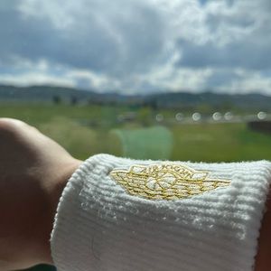 JORDAN gold and white wrist band